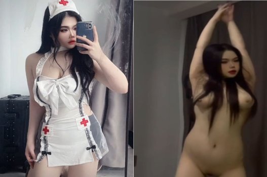 Bà y tá có bộ ngực lớn chăm sóc bệnh nhân